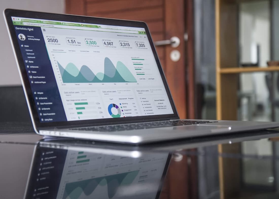 A close-up of analytics data on a laptop screen during a campaign review session